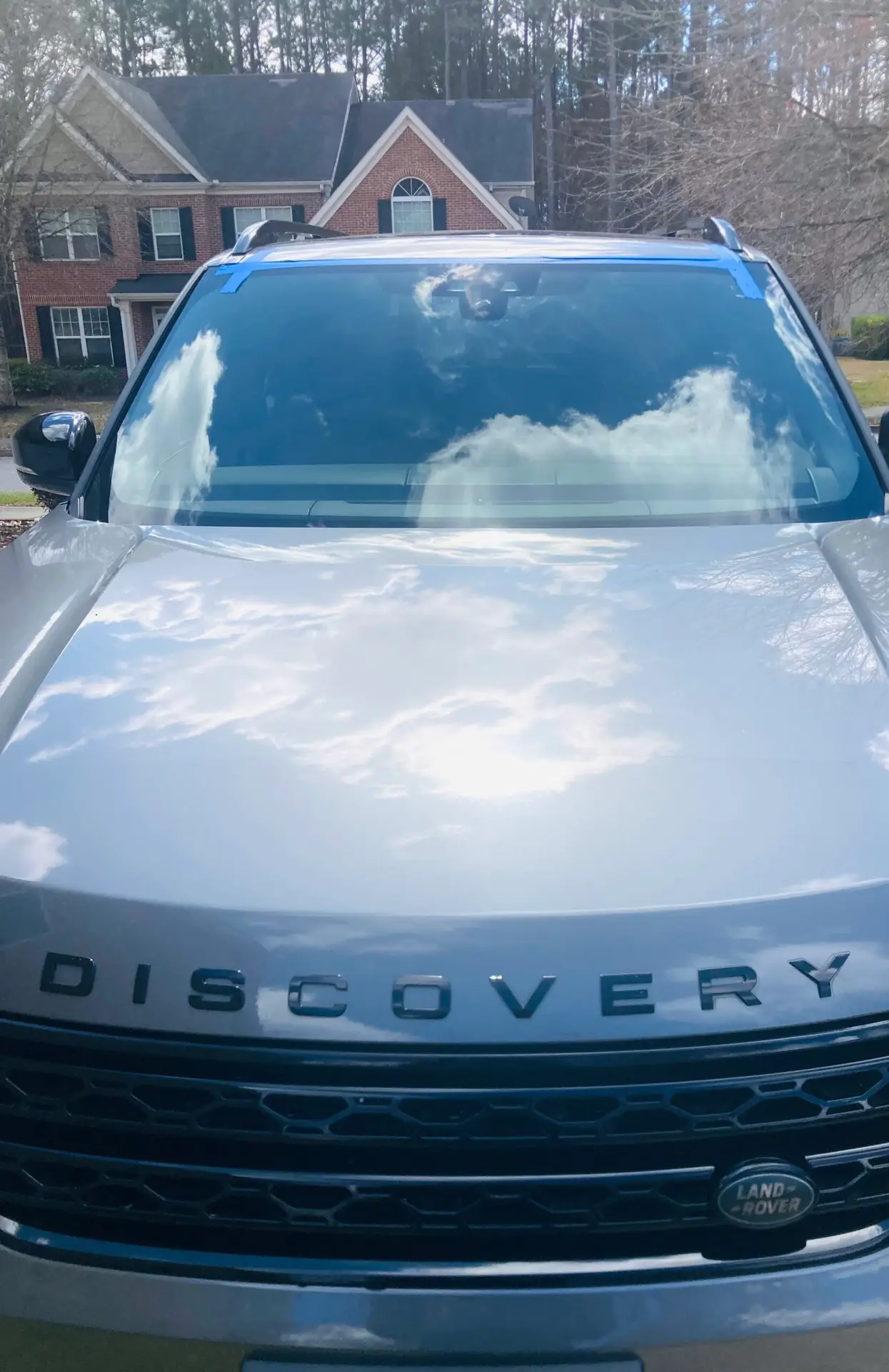 Windshield Replacement at Your Home. Mobile Service - The view is a Discovery Land Rover vehicle with a windshield repaired at a home in Atlanta, Georgia.