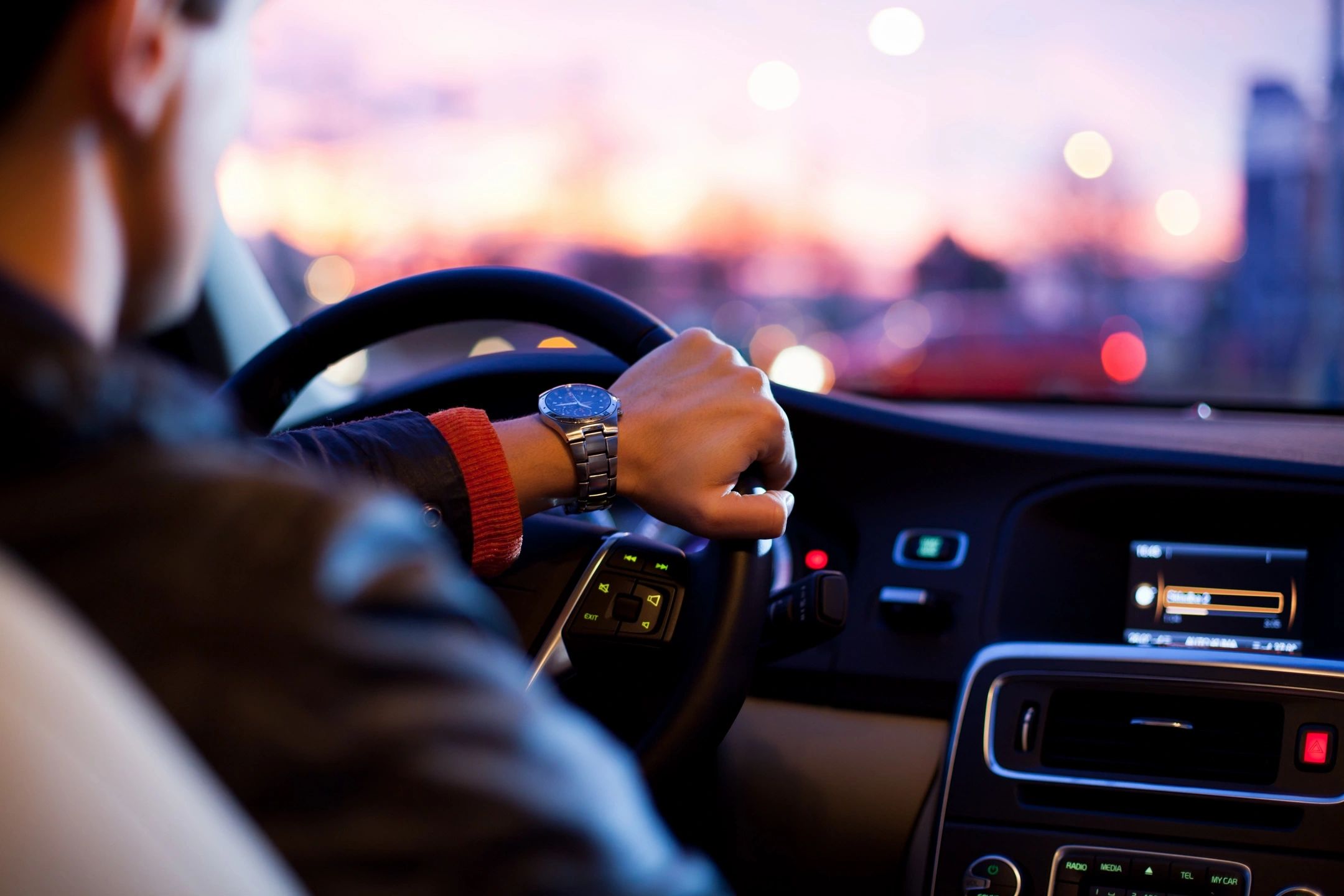 A man driving with a clear view and new windshield 